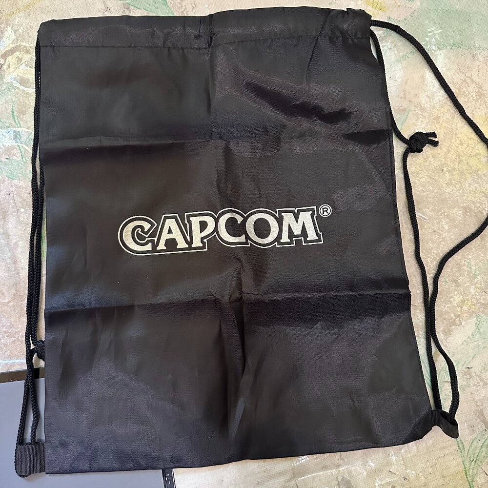 Capcom 10" x 13" Black Drawstring Backpack Tote Carrying Bag